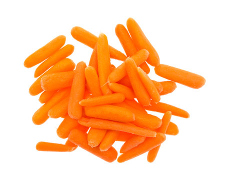 Small organic baby carrots on a white background