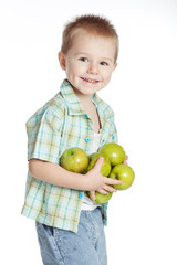 A boy with green apples in studio 