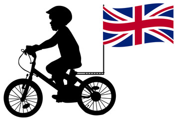 Fototapeta premium A kid silhouette rides a bicycle with United Kingdom flag
