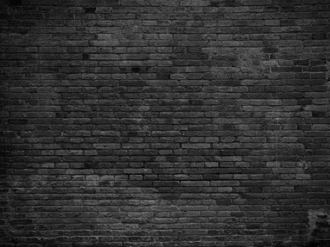 Part of black painted brick wall. Empty