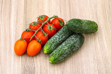 Cucumbers and tomatoes on the branch