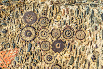 Pavement texture with gears and bricks in Montjuic, Barcelona, S
