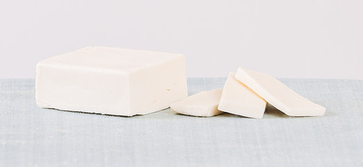 A plate of gourmet raspberry shortbread cookies with a glass of milk cheese butter