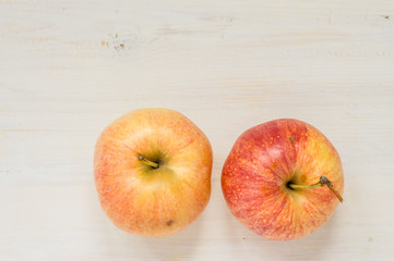 Two apples on a white table