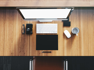 Generic design desktop computer on the wooden table with business elements.  Top view. 3D rendering
