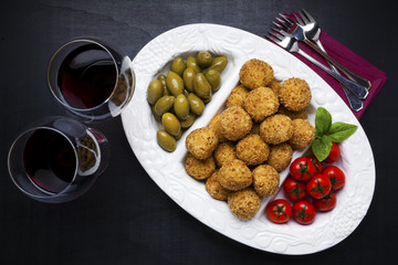 Healthy Italian Appetizer with Risotto Balls Arancini , green Ol