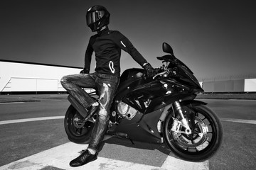 Fototapeta na wymiar Man in helmet on motorcycle