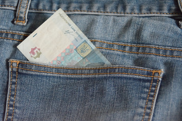 Fine hryvnia note in the pocket of jeans