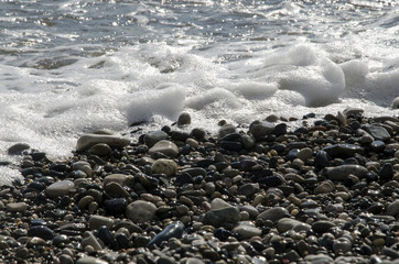 Pebbles and sea foam