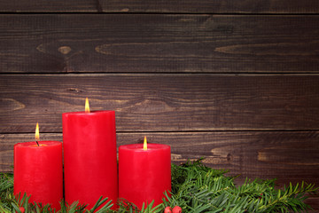 Christmas candle with wooden copy space