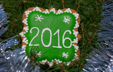 Christmas gingerbread 2016 over xmas tree with tinsel
