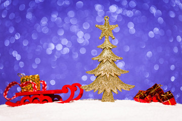 christmas ornament in snow on glitter background