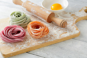 color pasta on board and rolling pin