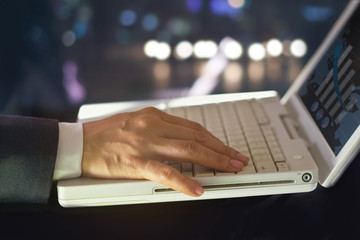 Business man use statistical data in the form of digital graphs