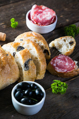 Bread with black olives salami, Italian snacks