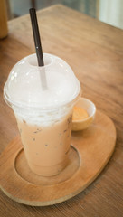 Ice caffe mocha serving on wooden table