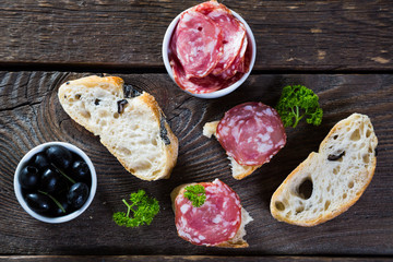Bread with black olives salami, Italian snacks