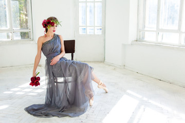 The beautiful ballerina sirtting in long gray dress  © master1305