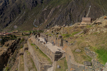 Tourists visit ruins in Ollantaytambo, Sacred Valley of Incas, Peru