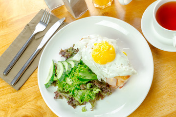 Fried egg and salad