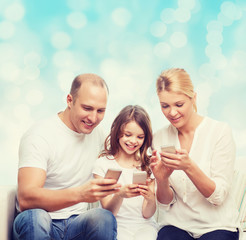 happy family with smartphones