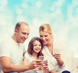 happy family with smartphones