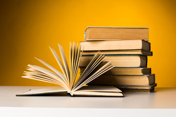 Books on yellow background