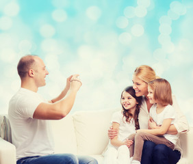 happy family with camera at home