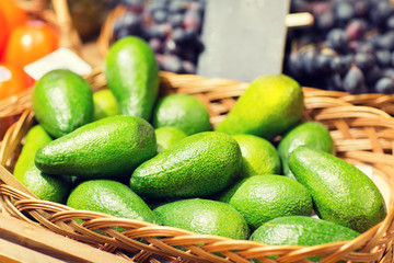 avocado in basket at food market