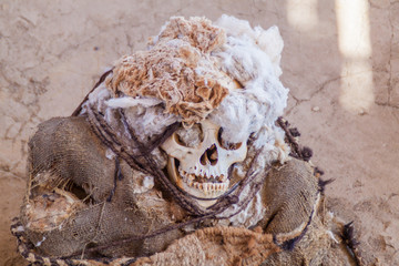 Preserved mummy in a tomb of Chauchilla cemetery in Nazca, Peru