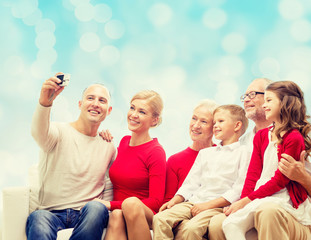 smiling family with camera