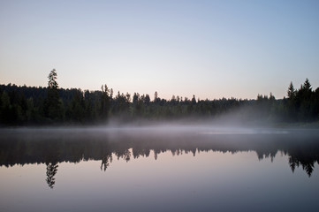 beautiful lake with mist early in the morning
