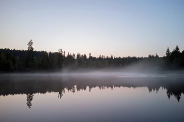 Foto op Plexiglas beautiful lake with mist early in the morning © Sunlove