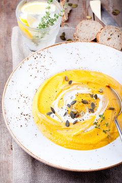 Pumpkin soup with cream, seeds and thyme 
