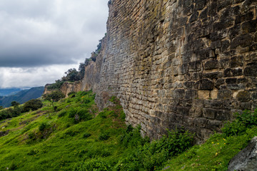 Stone wall of Kuelap, ruined citadel city of Chachapoyas cloud forest culture in mountains of...