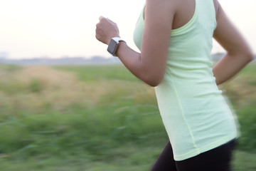 women wear hand watch running motion blur concept