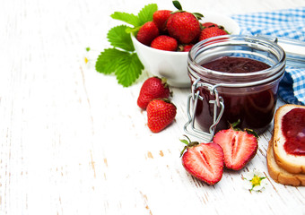Strawberry jam and fresh strawberries