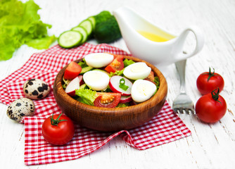 Spring salad with eggs, cucumbers and radish