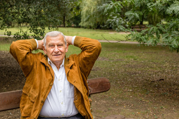 Senior  holding hands behind his head