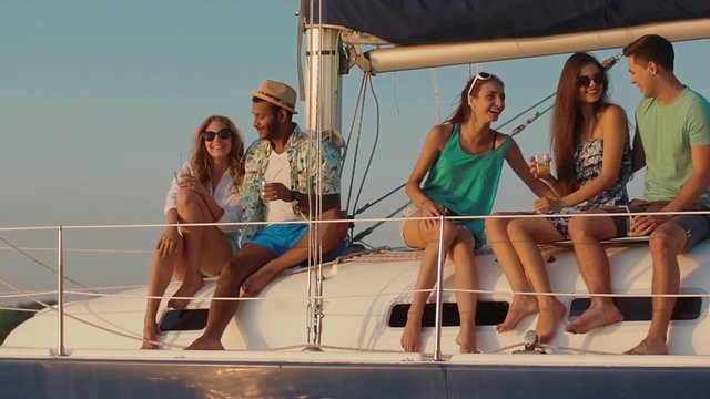 Young people relaxing on a yacht.
