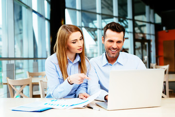 Young professionals looking at a website