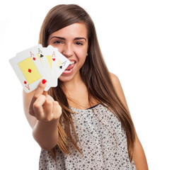 portrait of young woman showing poker cards isolated on white