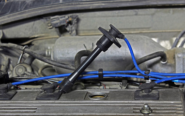 Fototapeta premium High-voltage wire in an automobile engine