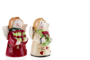 Christmas angels bringing gifts / Photography of a little angels bringing Christmas gifts. Isolated on white background. Stock photography.