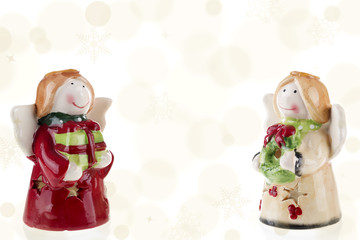 Little angels Christmas with gifts on bokeh background / Photography of a little angels bringing Christmas gifts on a golden bokeh background. Stock photography.