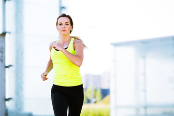 Photo of determined young woman running
