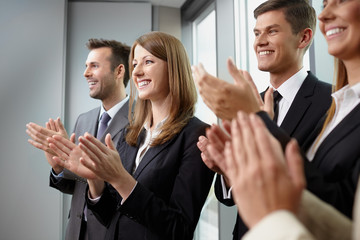 Group of business people clapping hands. Business seminar concep