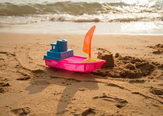 Toy on the beach sand castle build