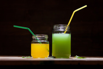 yellow and green juice in a jar
