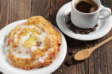 Bun with cherry and coffee